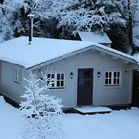 Two Bedroom Log Cabin in snow