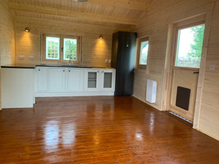log cabin interior with varnished floor