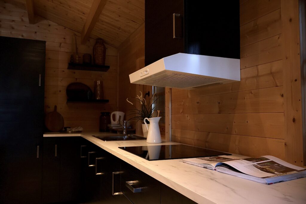 Log cabin kitchen interior Ireland with modern units and timber finish